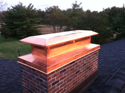 Before and after chimney cap replacement in Elmont, NY