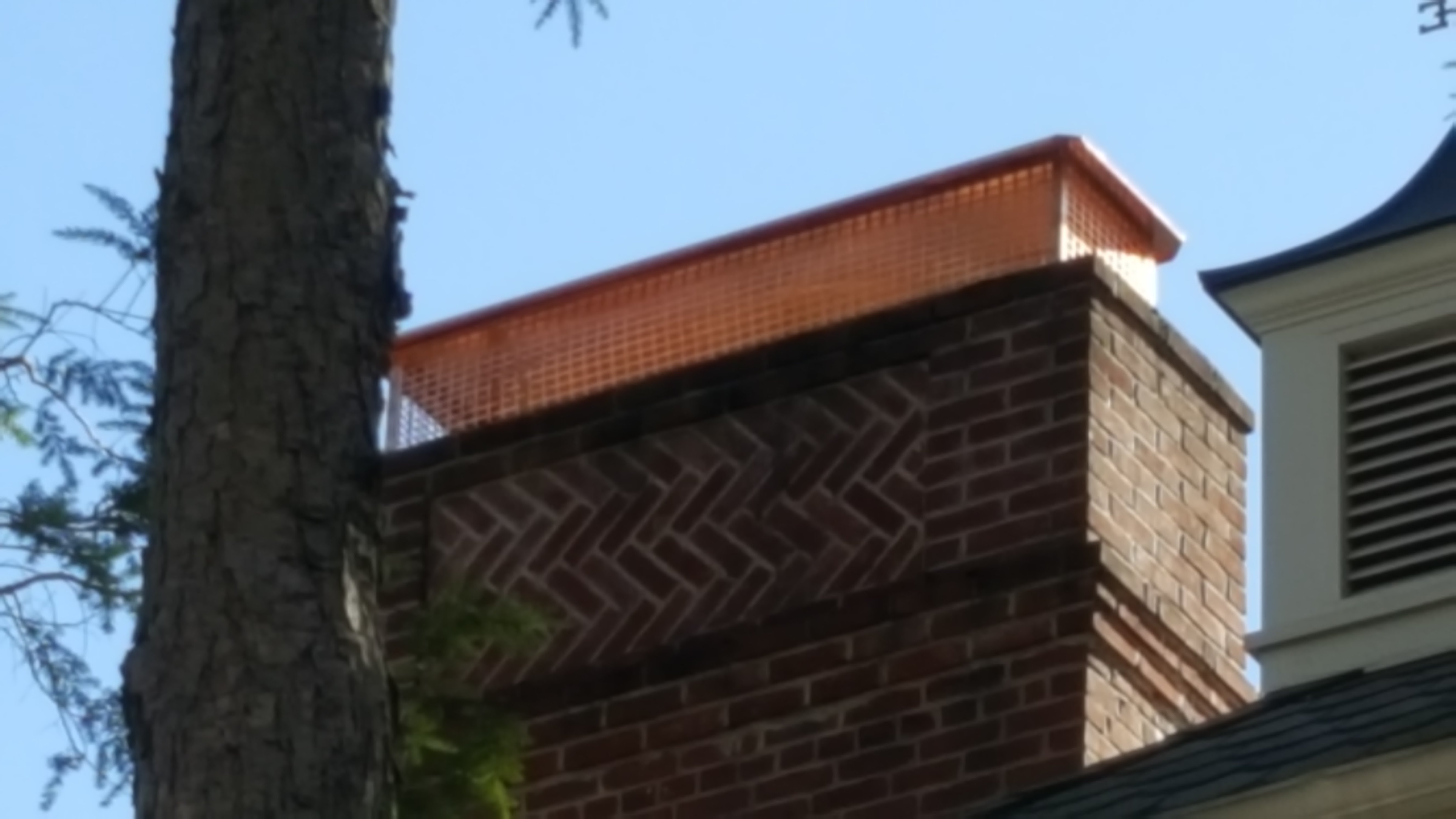 New stainless steel chimney cap installed in Elmont, NY