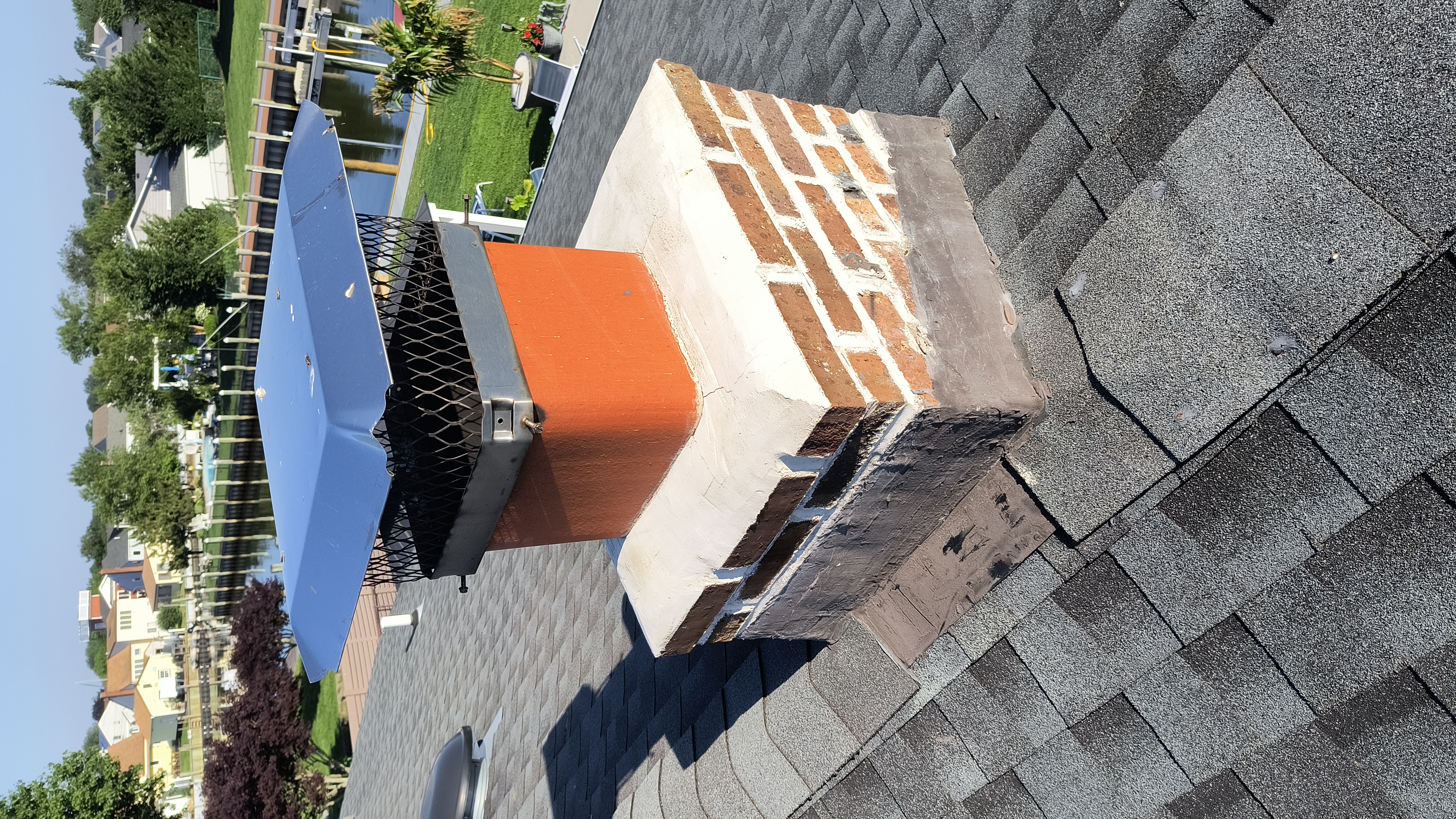 Full chimney masonry rebuild and restoration in Elmont, NY