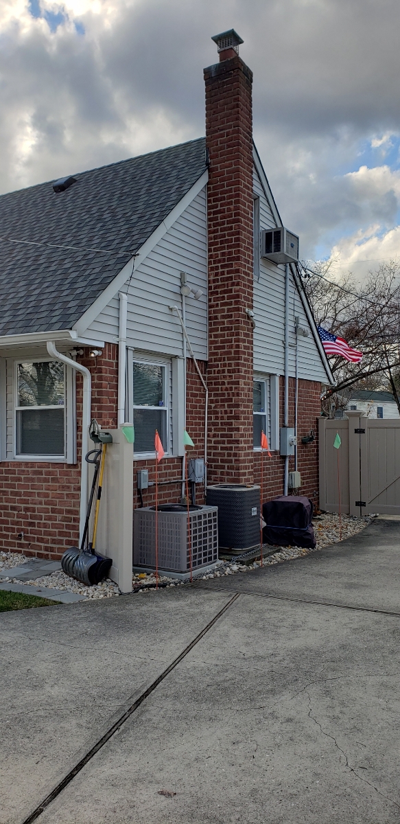 Professional chimney repointing restoring brick joints in Elmont, NY