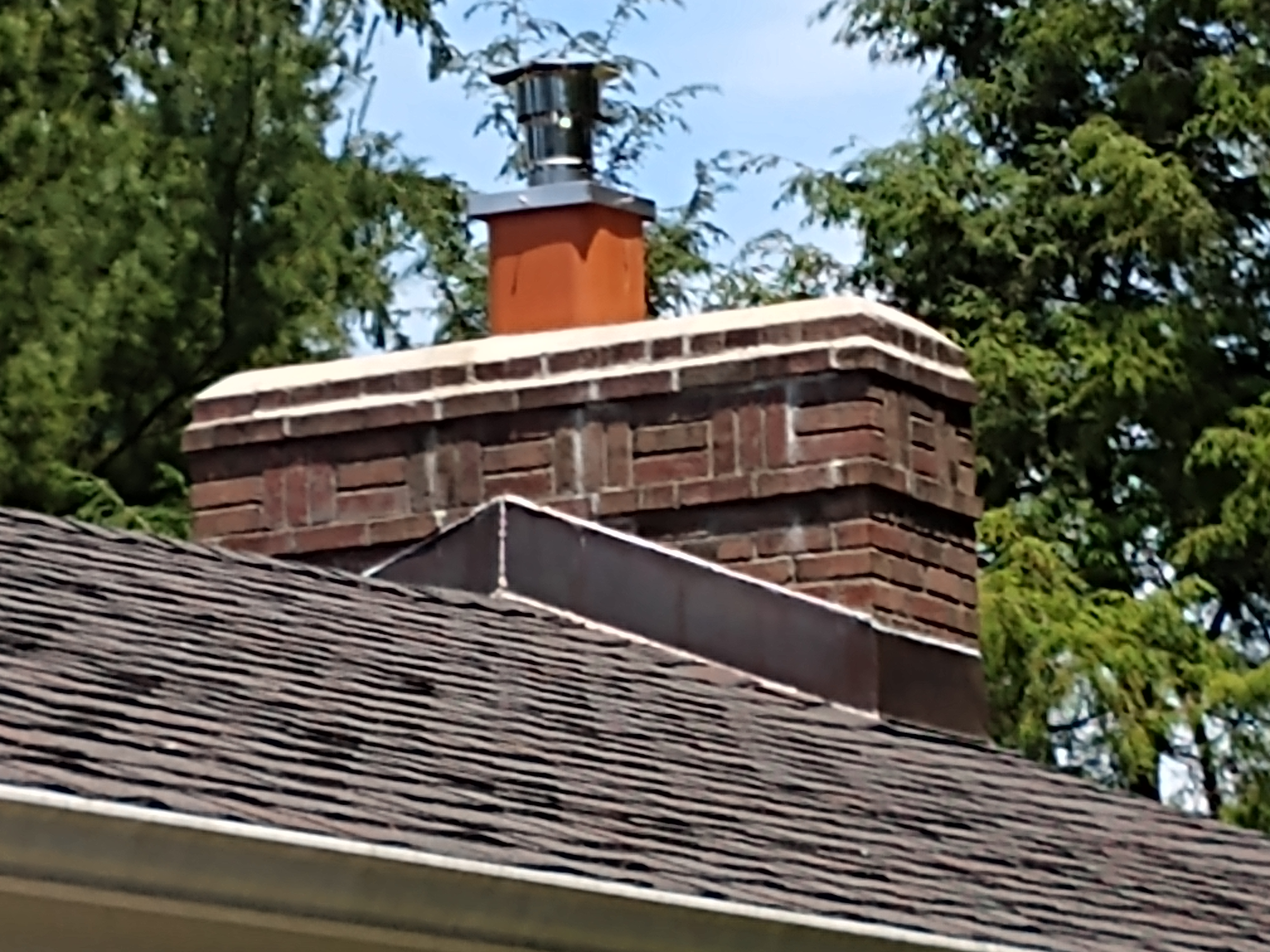 Stainless steel chimney cap with animal guard in Elmont, New York